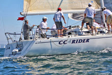 J/120 sailing around mark in San Diego J/Fest