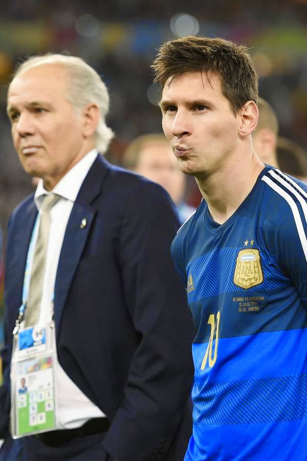 Argentina's forward and captain Lionel Messi (R) and Argentina's coach Alejandro Sabella (C) react after losing the 2014 FIFA World Cup final football match between Germany and Argentina 1-0 following extra-time at the Maracana Stadium, in Rio de Janeiro, on July 13, 2014. 