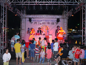 singers and dancers on the stage at Zhuhai's October Beer Street Festival