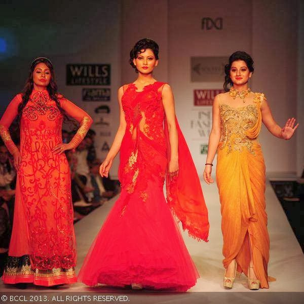 Anjali Abrol, Urvashi Rautela and Simran, the actors from the movie Singh Sahab the Great, walk the ramp for fashion designer Sulakshana on Day 5 of Wills Lifestyle India Fashion Week (WIFW) Spring/Summer 2014, held in Delhi. 