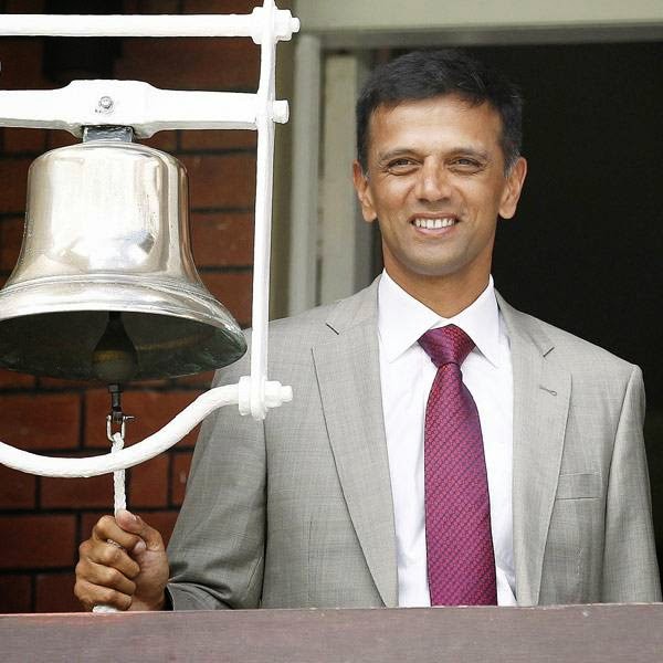 Former India cricketer Rahul Dravid rings the five-minute bell prior to the start of play on the first day of the second cricket Test match between England and India at Lord's cricket ground in London, on July 17, 2014.