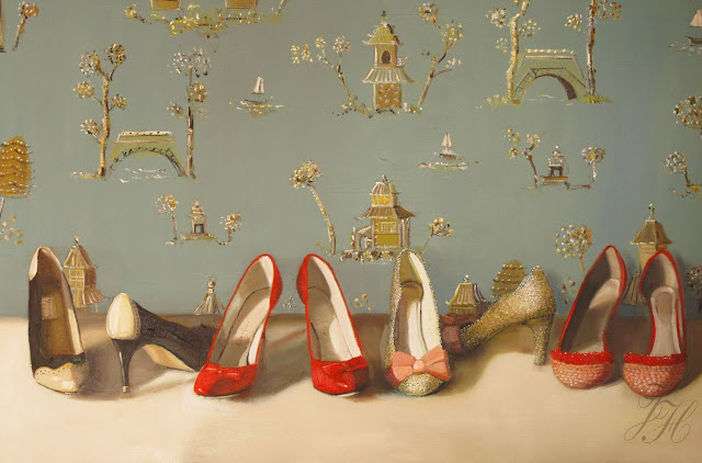 Artwork that is lots of high heeled shoes in front of wallpapered walls.