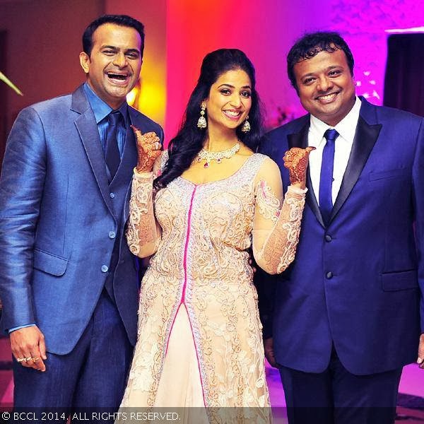 (L-R) Siddharth Kannan with his bride Neha Agarwal and brother Hrishikesh duing his wedding, held at JW Marriott, in Mumbai, on February 4, 2014.