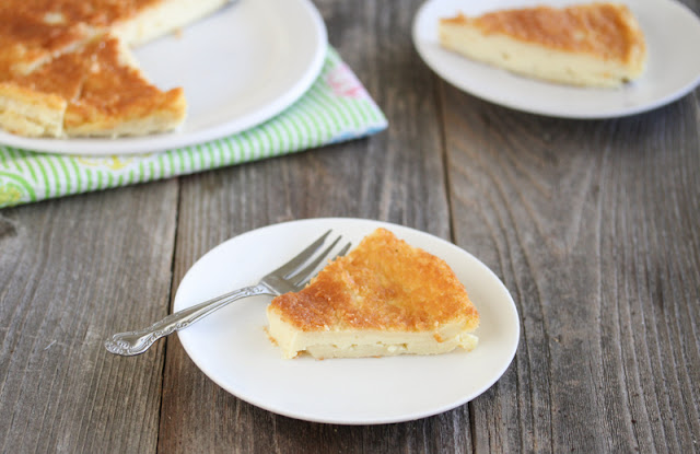 photo of a slice of Magic Custard Pie on a plate with a fork