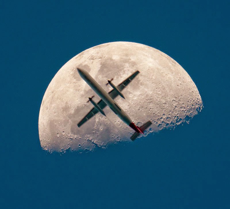 airplane-passing-the-mooon-perfect-timing.