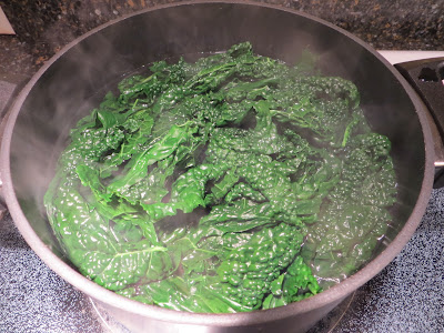 Kale getting blanched into a beautiful green