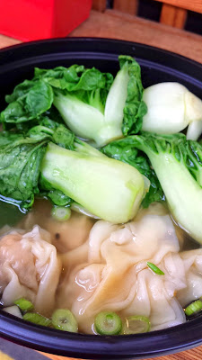 Mama Chow's Kitchen, taking orders at Mama Chow's Kitchen for his mom's Wontons in wonton soup (pork, shrimp or chicken wontons in house broth with baby bok choy)