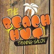 THE BEACH HUT TANNING SALON logo