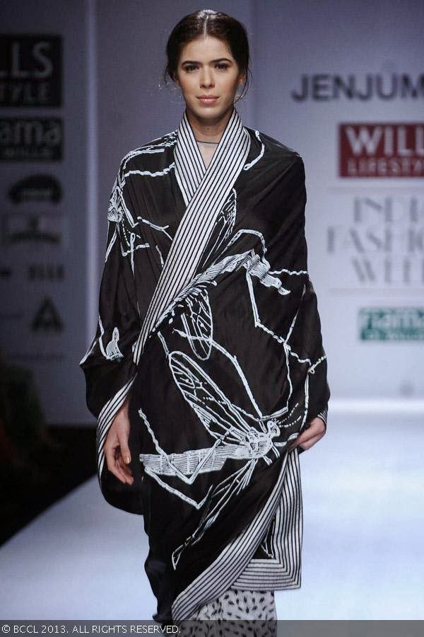 Sucheta Sharma walks the ramp for fashion designer Jenjum Gadi on Day 3 of the Wills Lifestyle India Fashion Week (WIFW) Spring/Summer 2014, held in Delhi.