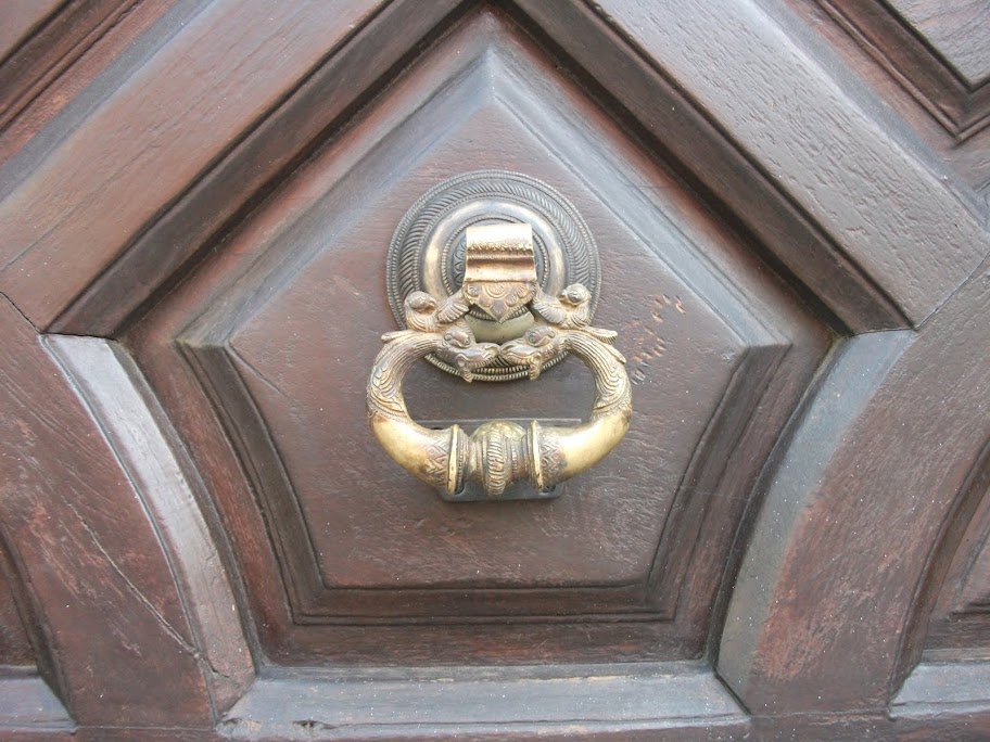 Bronze latch over wooden door, downtown Cuernavaca, Morelos