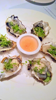 Netarts Oysters on the half shell with citrus mignonette at Bluehour Portland