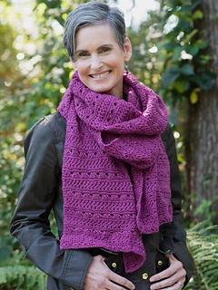 woman wearing a purple knit scarf outside