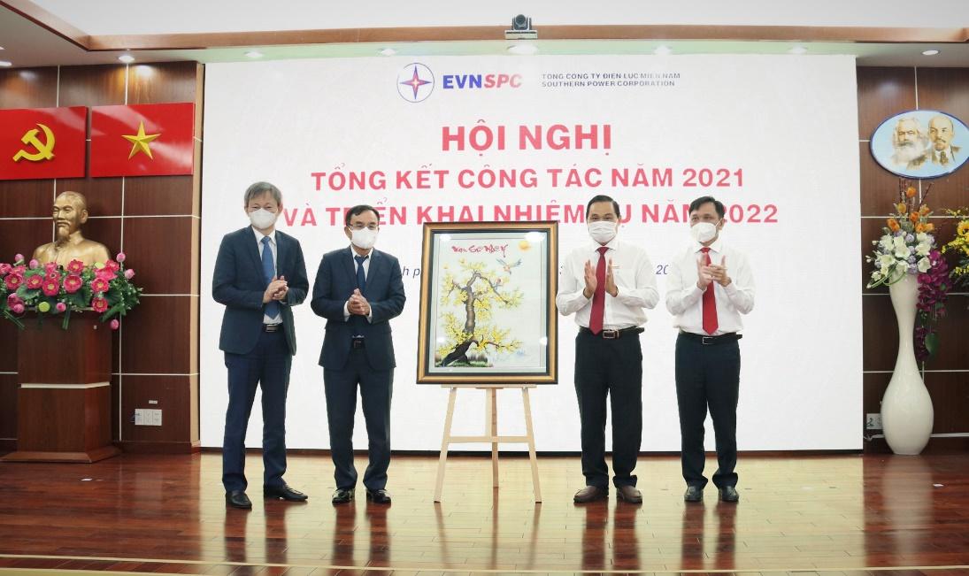 A group of people standing in front of a signDescription automatically generated with medium confidence