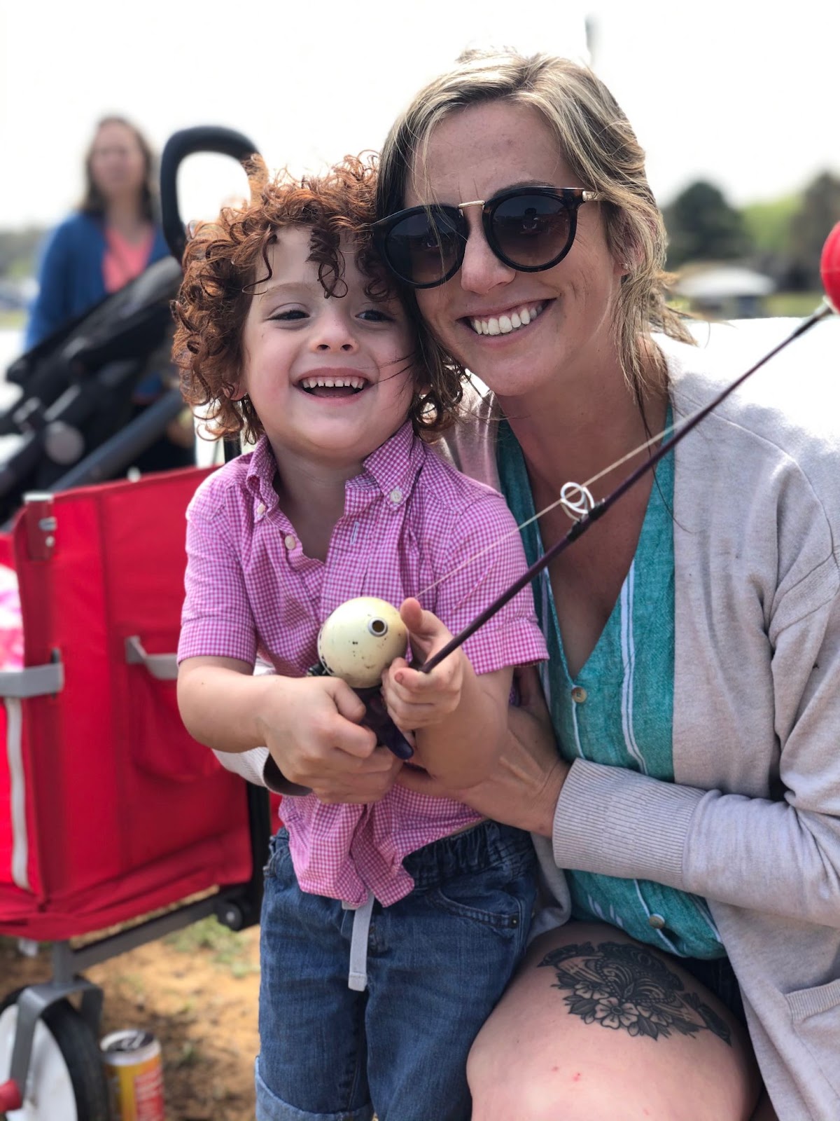 mom and son showing off fish