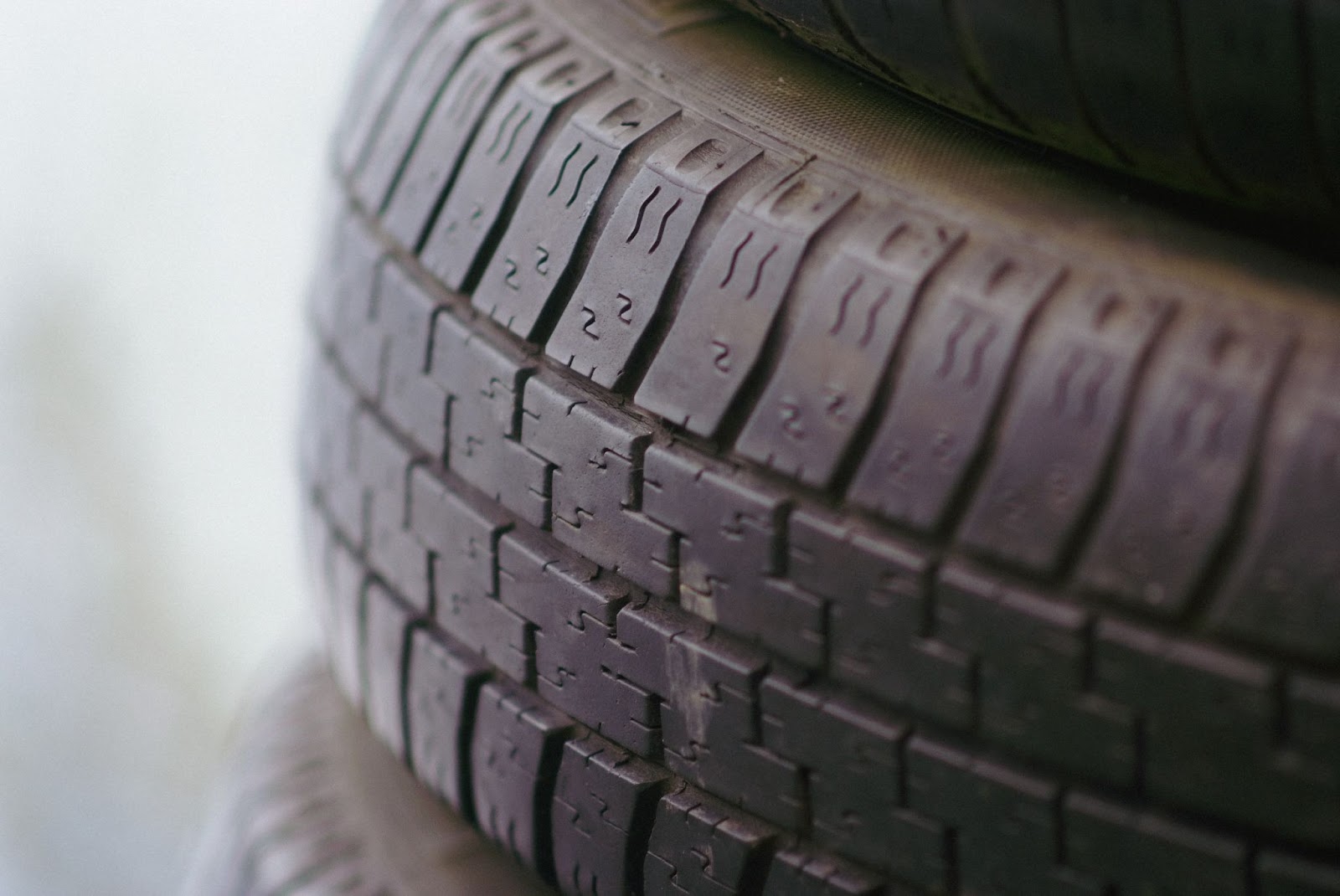 A close-up macro-filtered picture of the tread of a tire