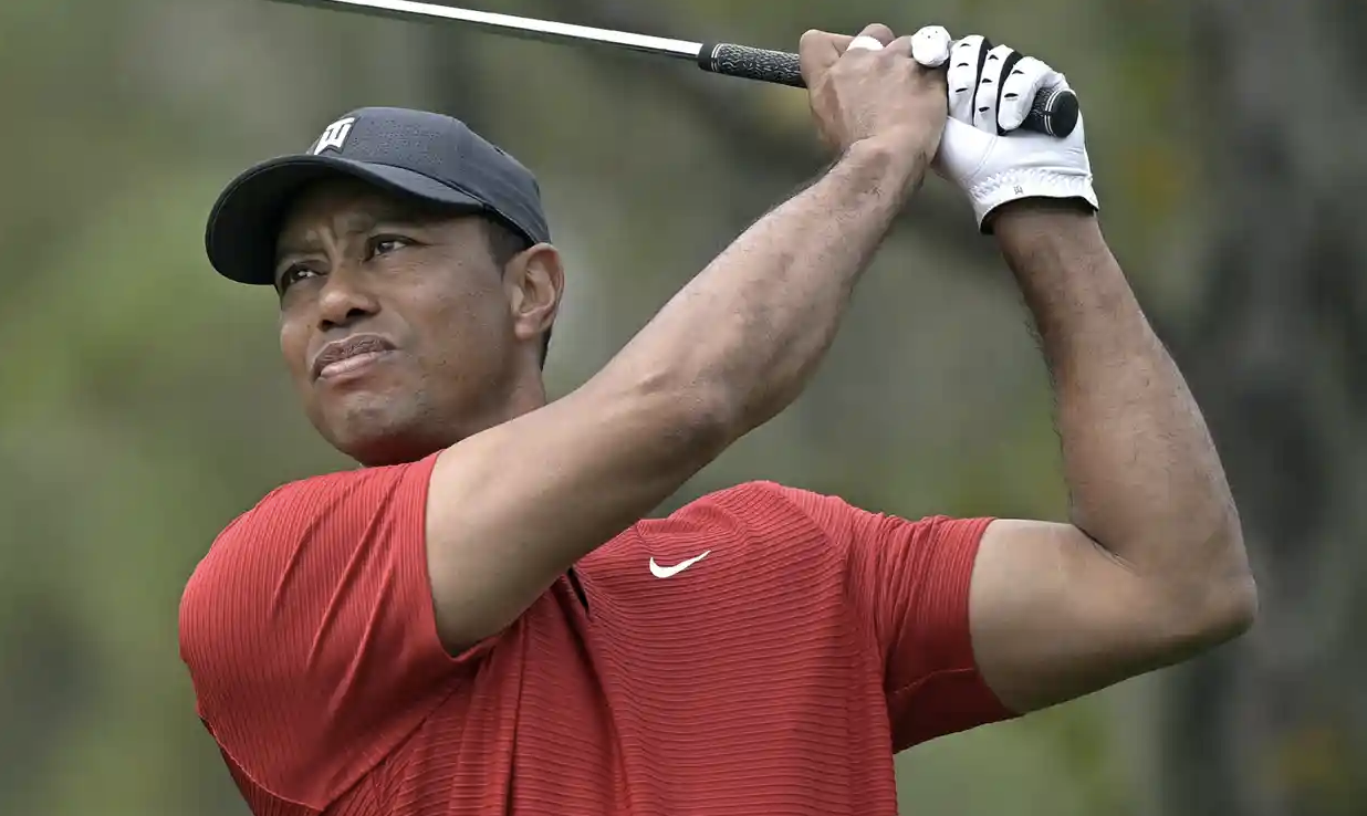 Tiger Woods hitting a stinger in golf