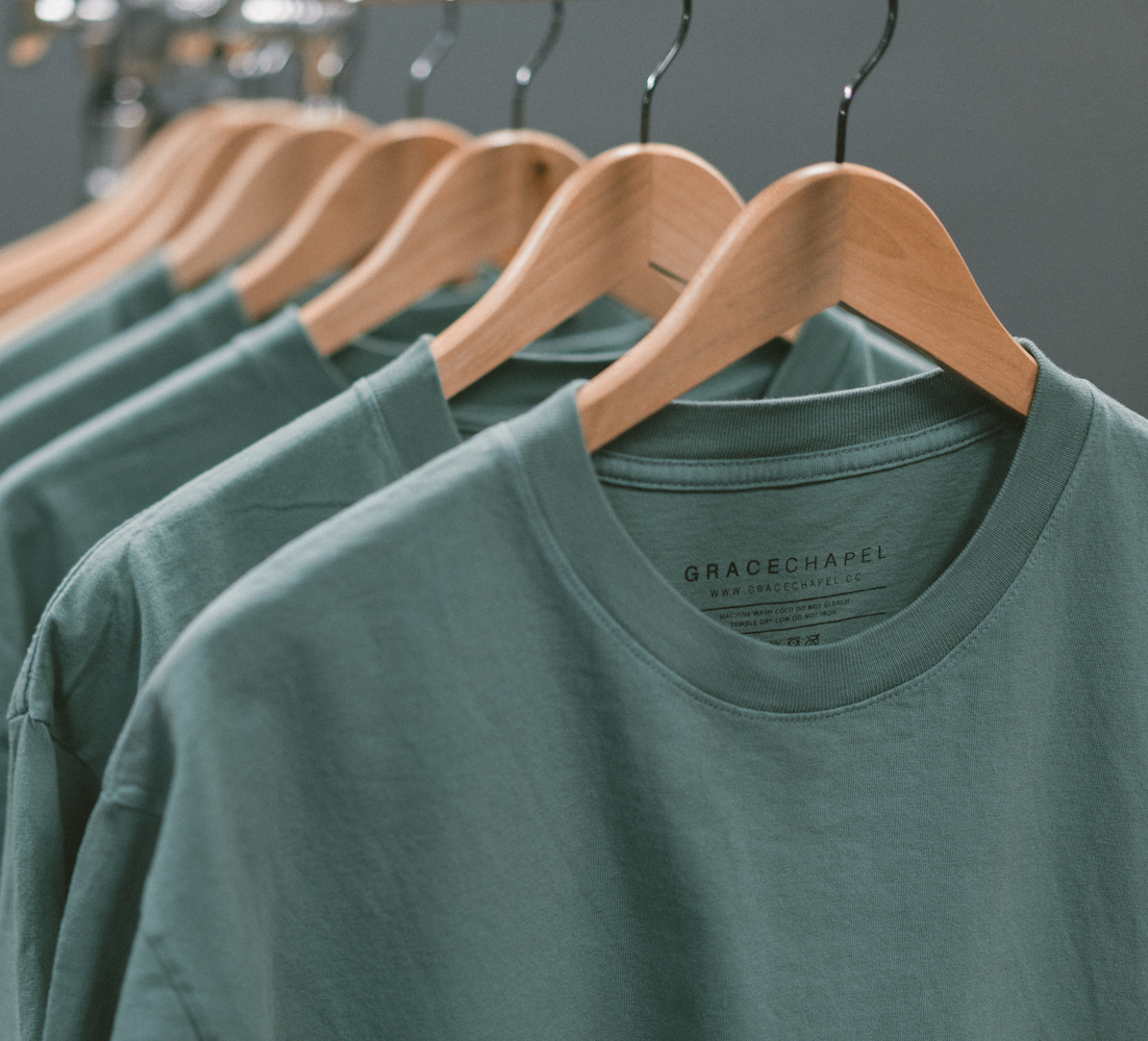 Row of t-shirts on hangers ready to order