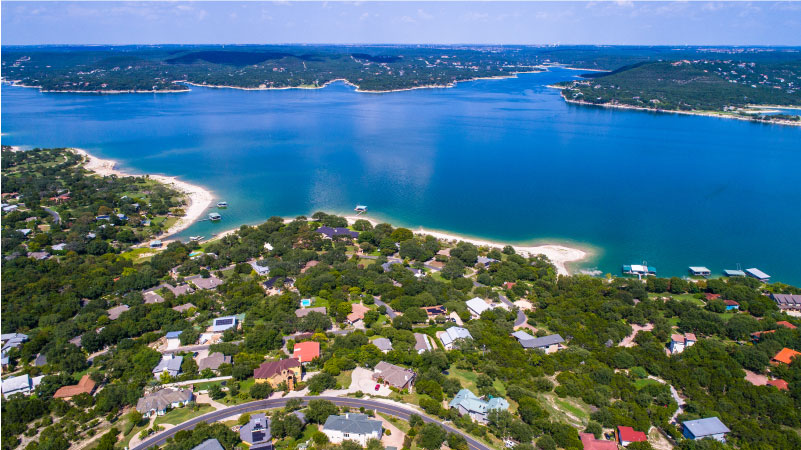 Aerial view above Lake Travis and Lakeway homes outside of Austin, TX