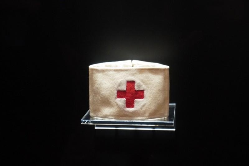 A picture containing first-aid kit, dark

Description automatically generated