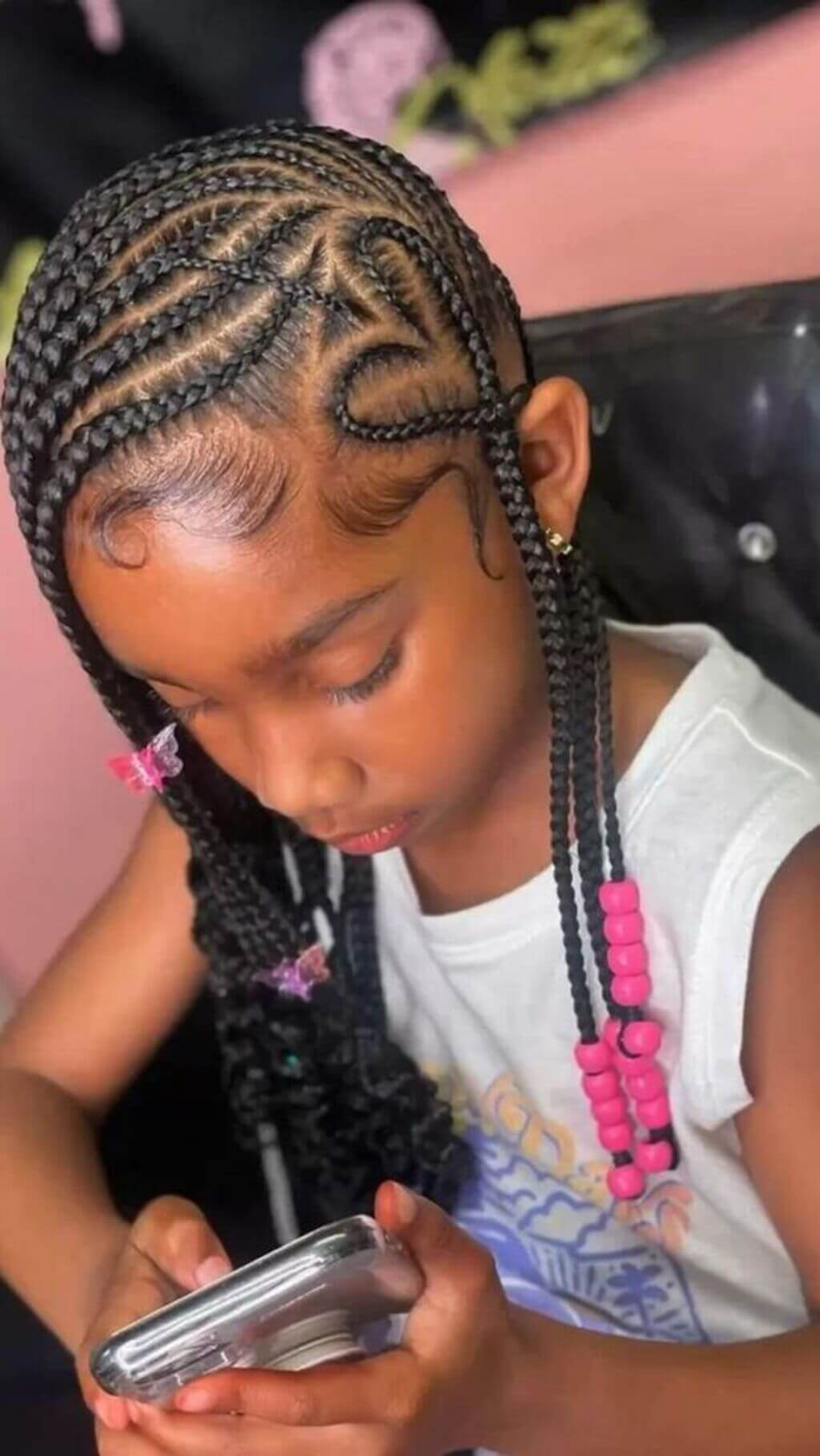 Kiddies braid hairstyle: Full picture  showing a young girl rocking her braids with beads
