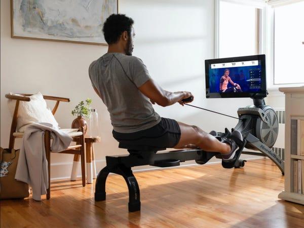 person using a NordicTrack rowing machine -- best rowing machines