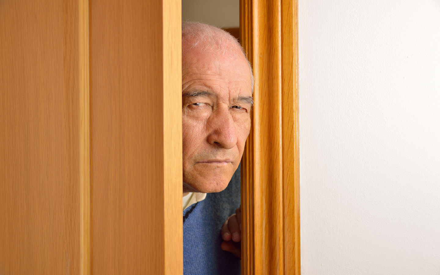 sneaky old man entering through door