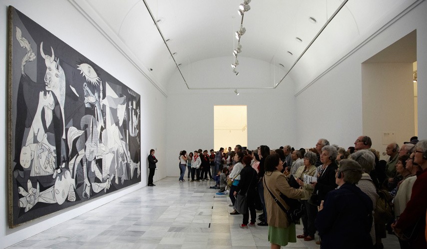 Photo of Picasso’s Guernica being displayed in a woman museum show