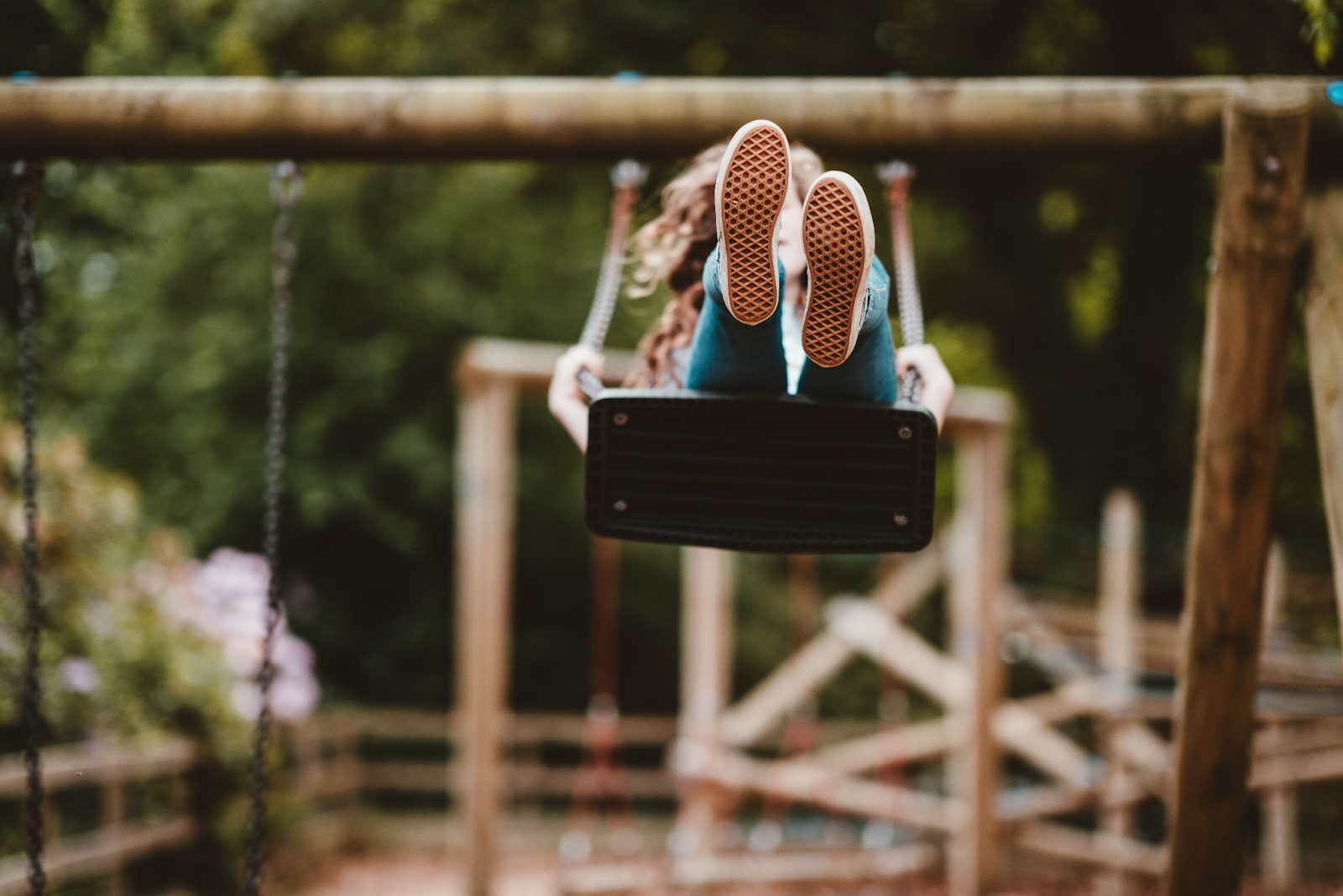 Girl on a swing in a playground
