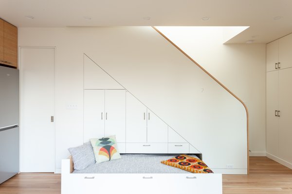 This beneath-stairs bed creates a unique space for guests that are visiting.