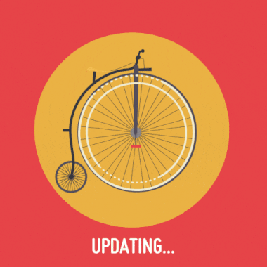 Gif of a Penny-farthing bike where the wheel is spinning. The background is red with a yellow circle behind the bike. Text below reads 'Updating...'. 