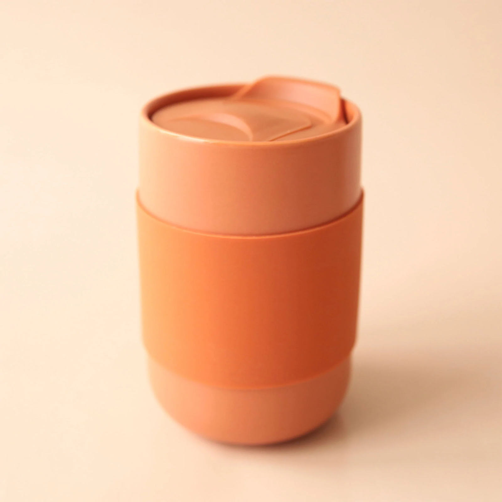 photo of a hot beverage tumbler in terracotta color