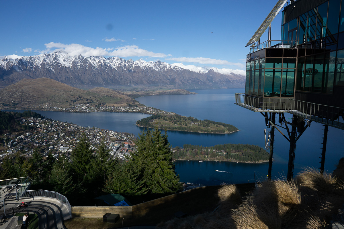 view of the sea and mountains from gondola while hiking the Ben Lomond Track in New Zealand