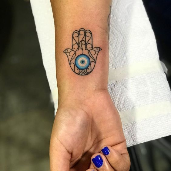 Another look at the evil eye tat on the arm