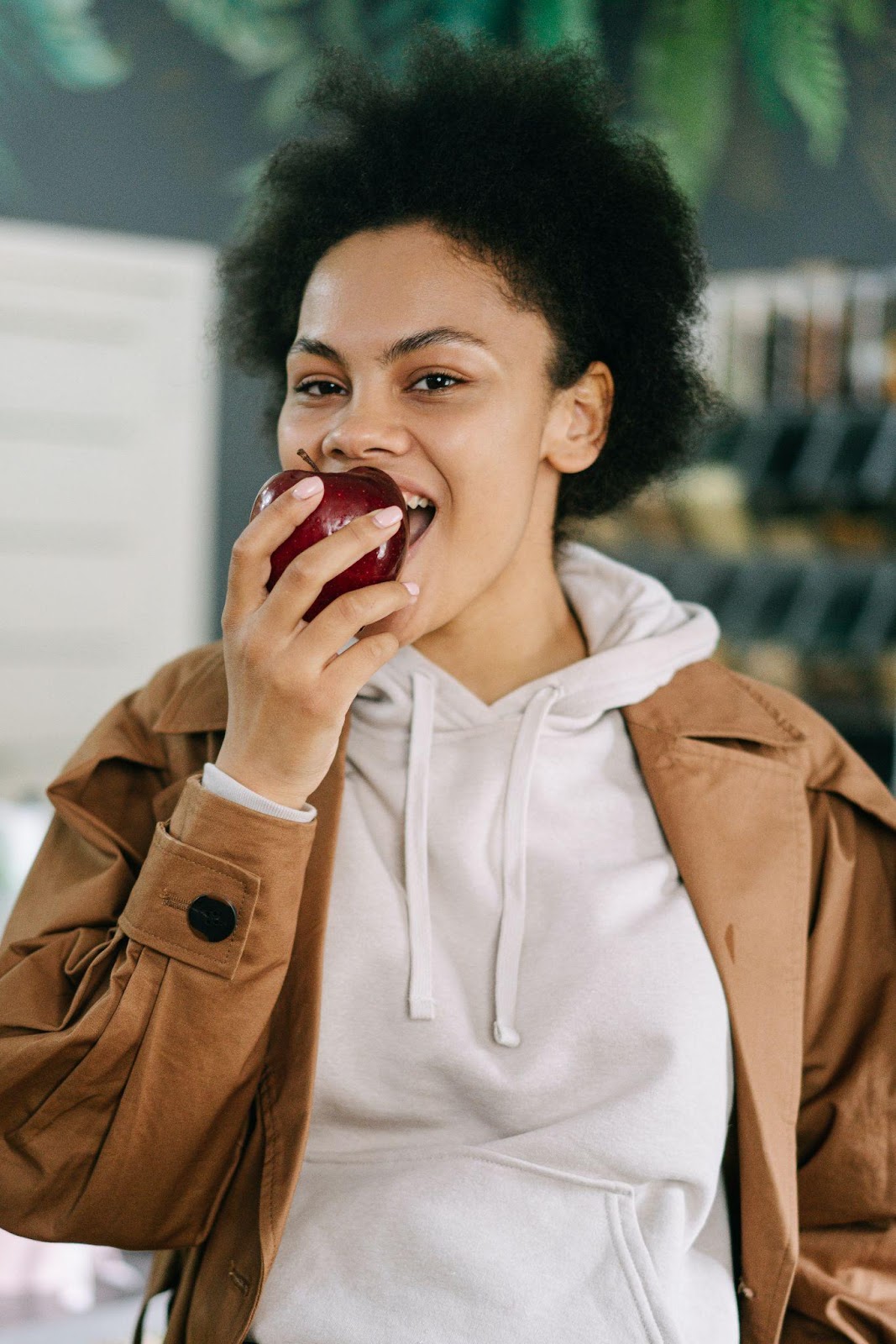 A girl munching on an apple