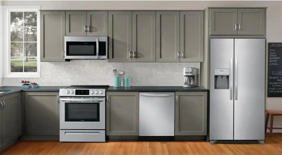 stainless steel kitchen appliances in a kitchen with gray cabinets