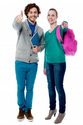 young man with notebook giving thumbs-up sign; young woman with backpack pointing