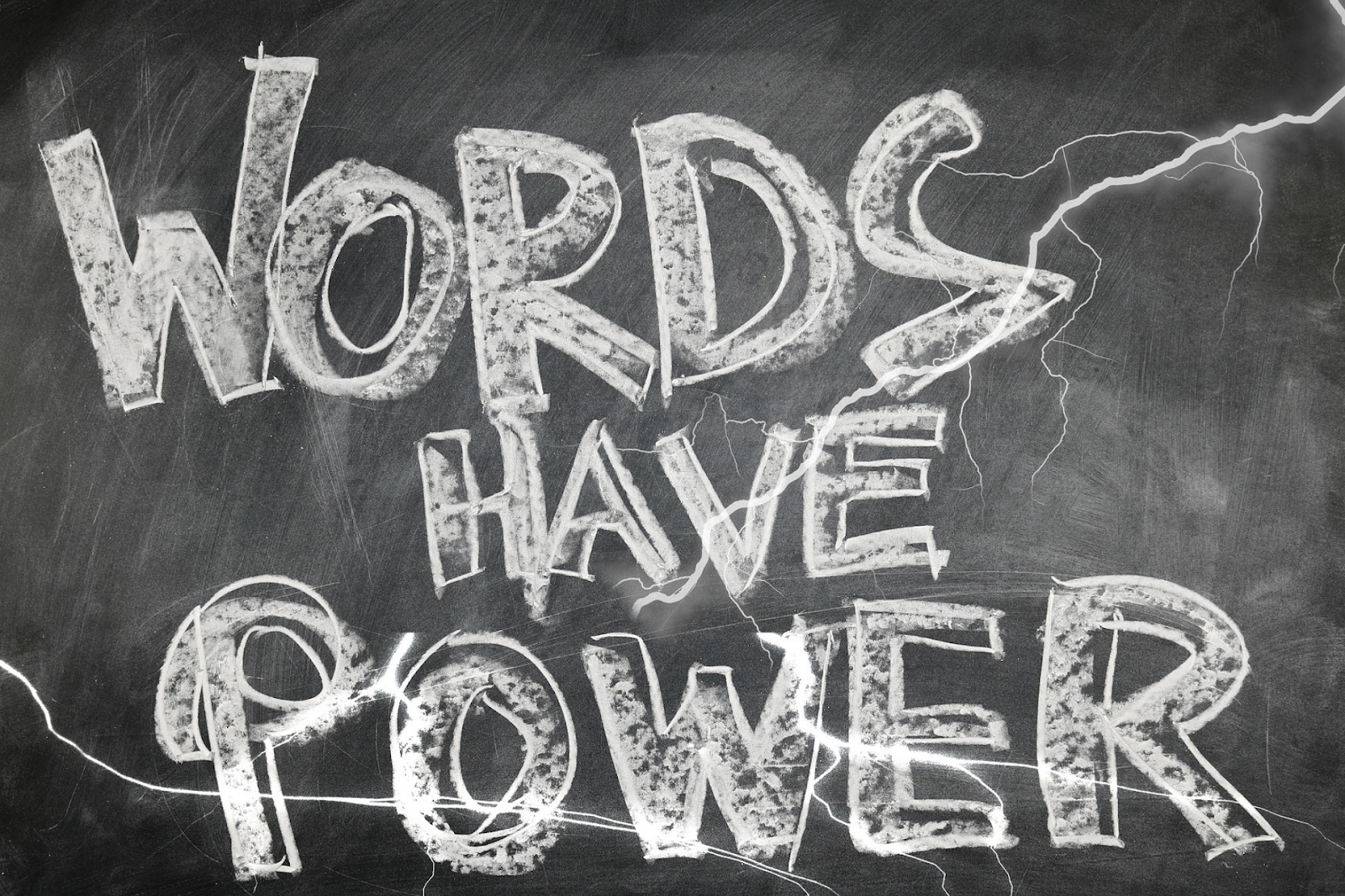 Words have power written on a chalk board