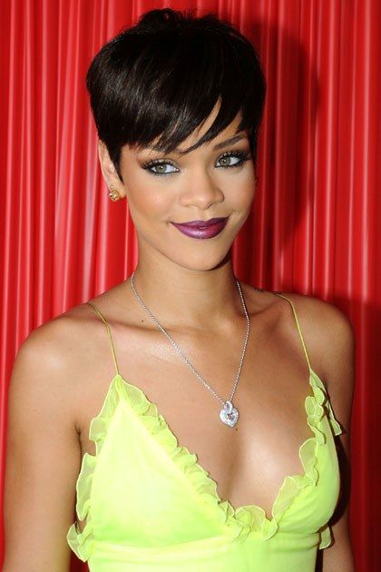smiling Rihanna wearing pixie cut hairstyle