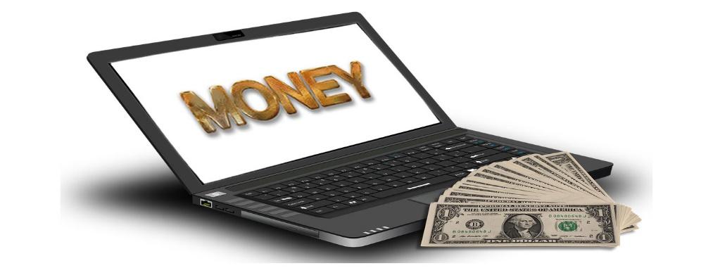 A close up of a computer with the word "money" on it.