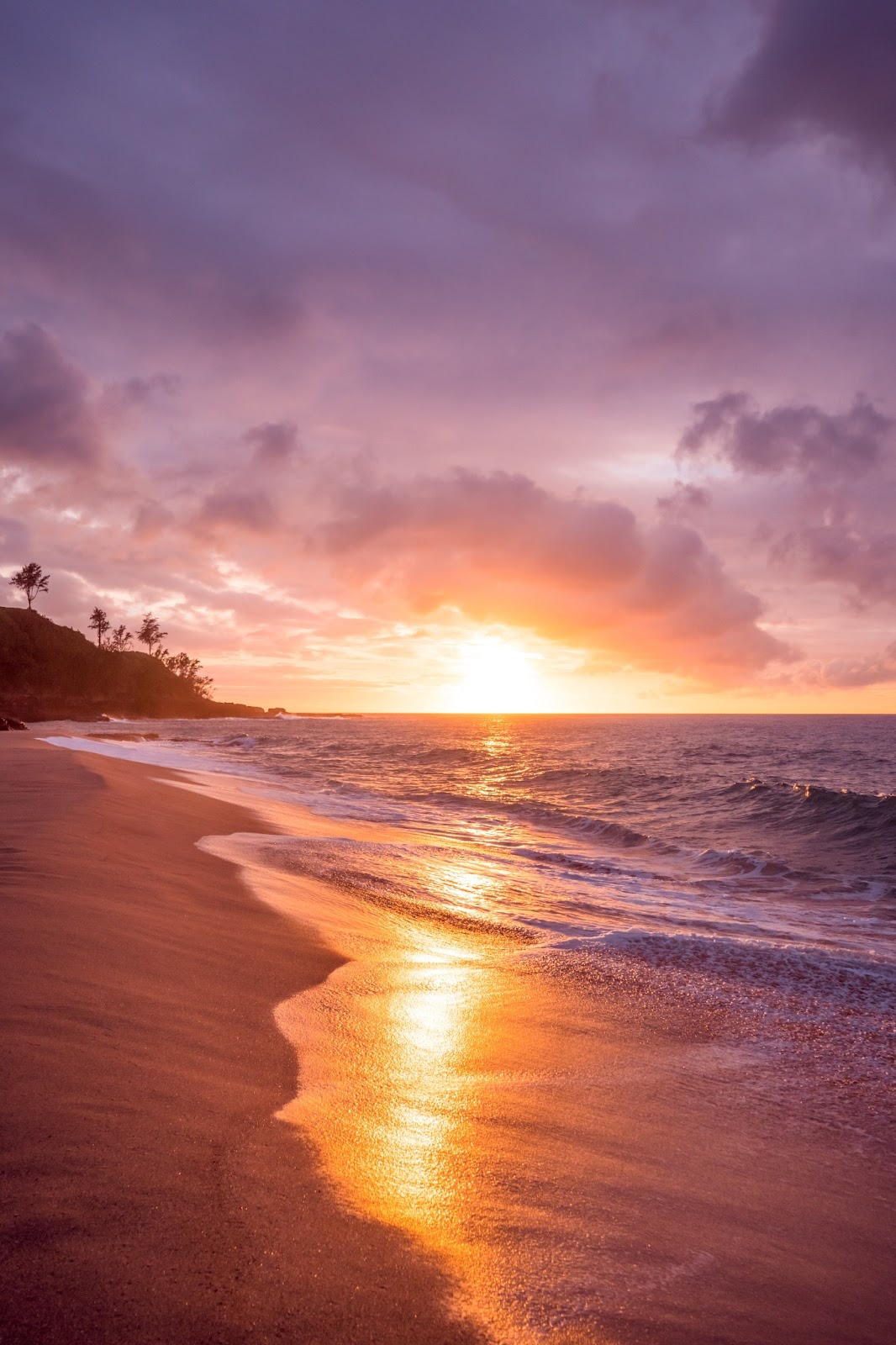 A beautiful Hawaiian beach at sunset.