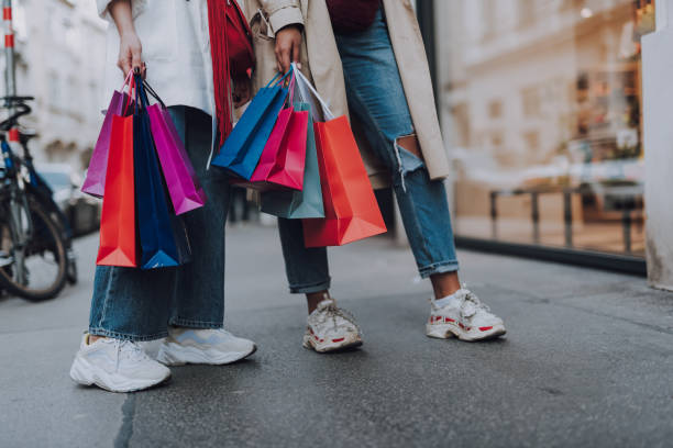 ladies holding shopping bags 