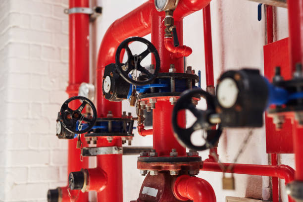 The first line of defence for your property's fire protection Shot of a fire sprinkler system in a building safety valves stock pictures, royalty-free photos & images