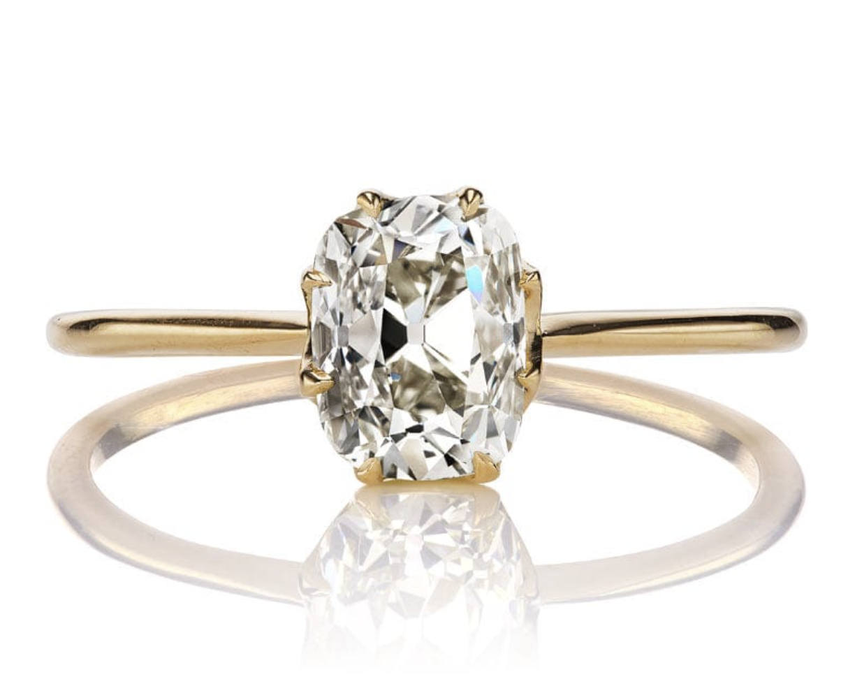 Elongated old mine cut diamond engagement ring