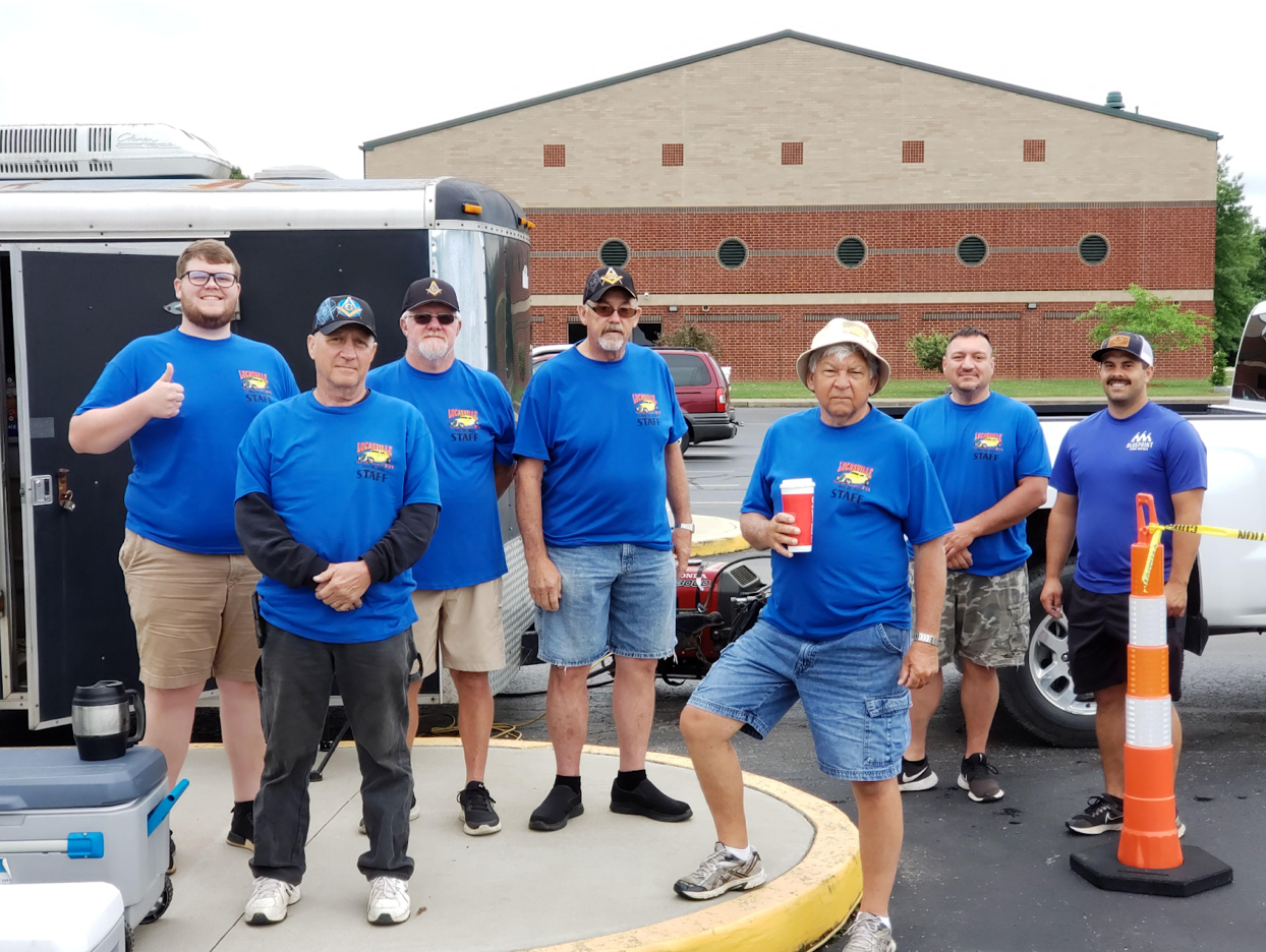 Picture of men in blue t-shirts at Masonic charity event.