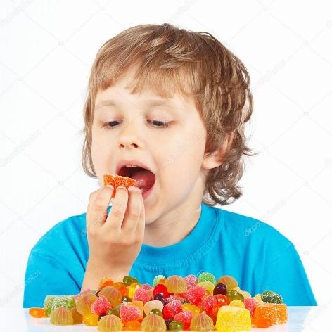 Little child eating jelly candies on white background — Stock Photo ©  borusikk #54202413
