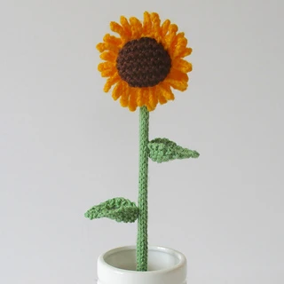 knitted sunflower in pot on white background