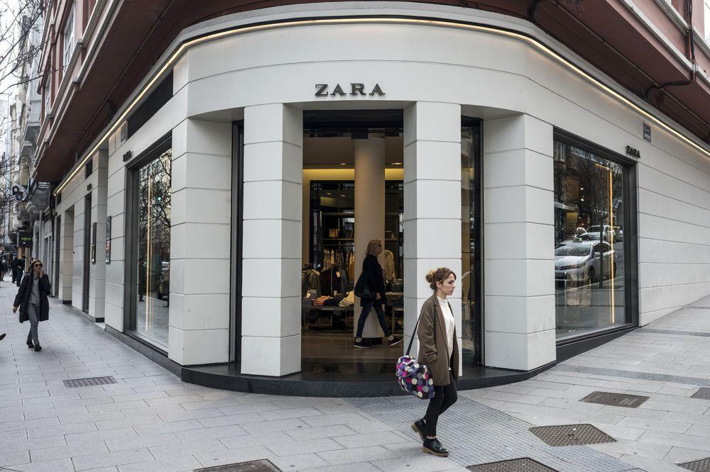A person walking in front of a store

Description automatically generated with low confidence