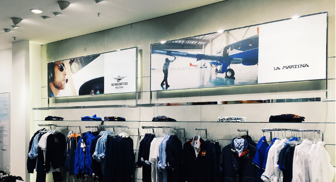 Digital screens in a clothing store.
