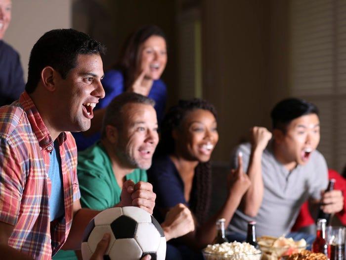 Soccer fans watching TV together.