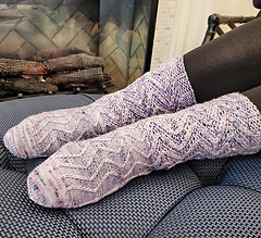 feet wearing standard length cable knit socks